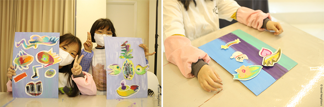 아트클래스에서 만든 작품과 함께 있는 아이들